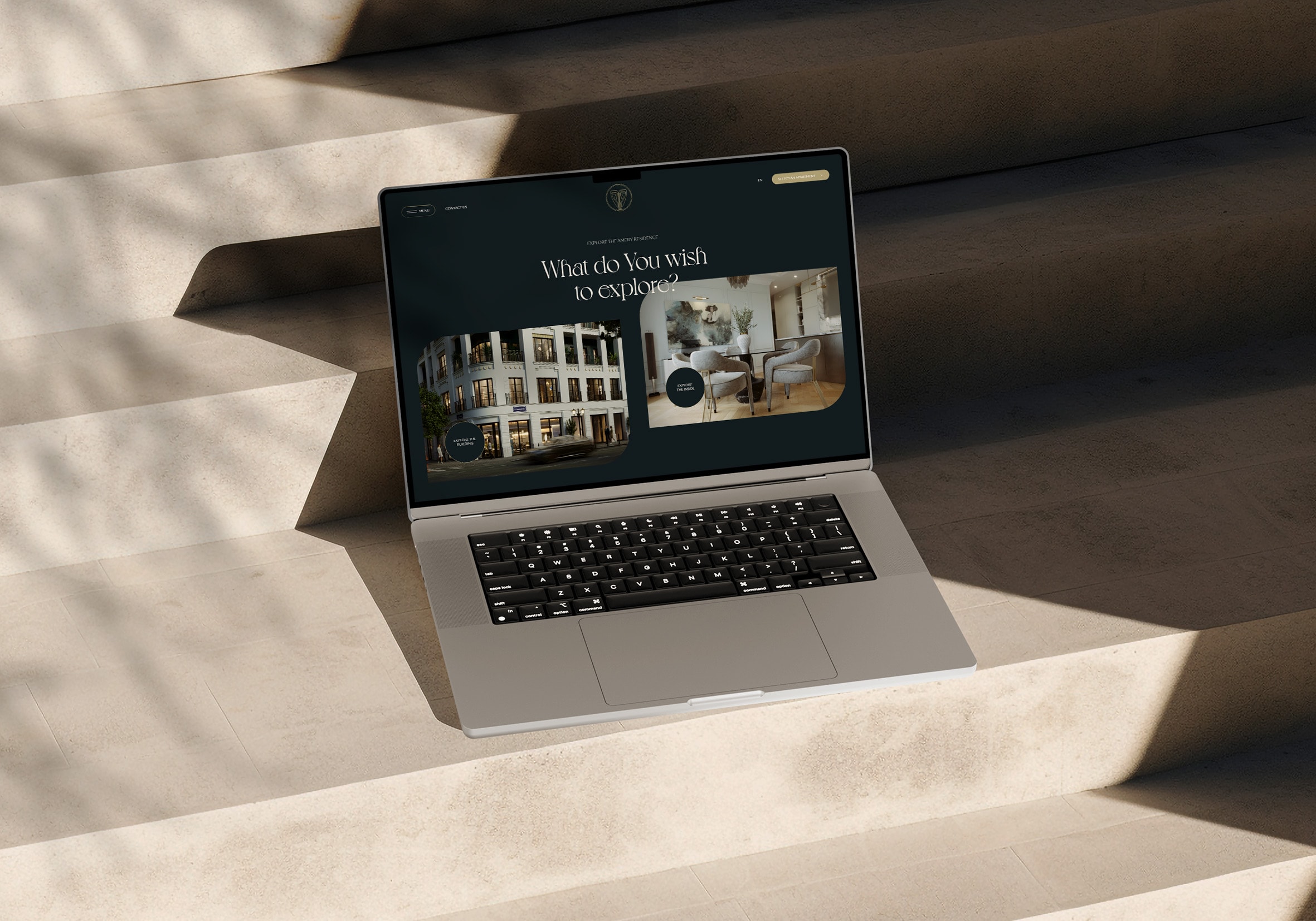 Amery Residence promo website home page on a laptop in dappled sunlight, UI design